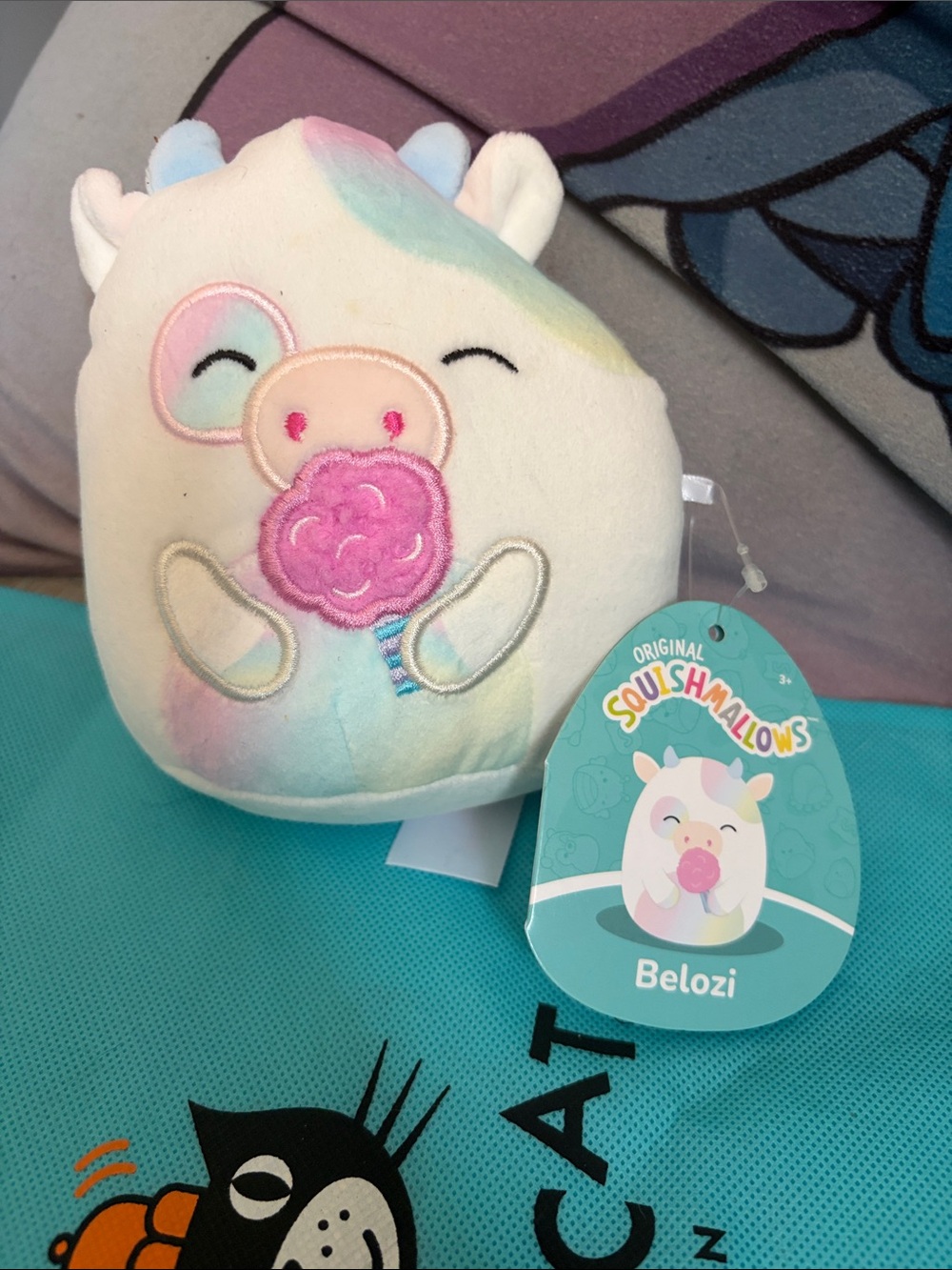 Squishmallows Belozi Plush - White with Pastel Rainbow Accents